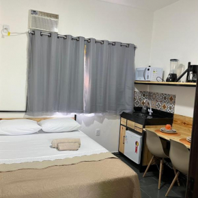 Flat com ar e varanda com linda vista para o Ibituruna